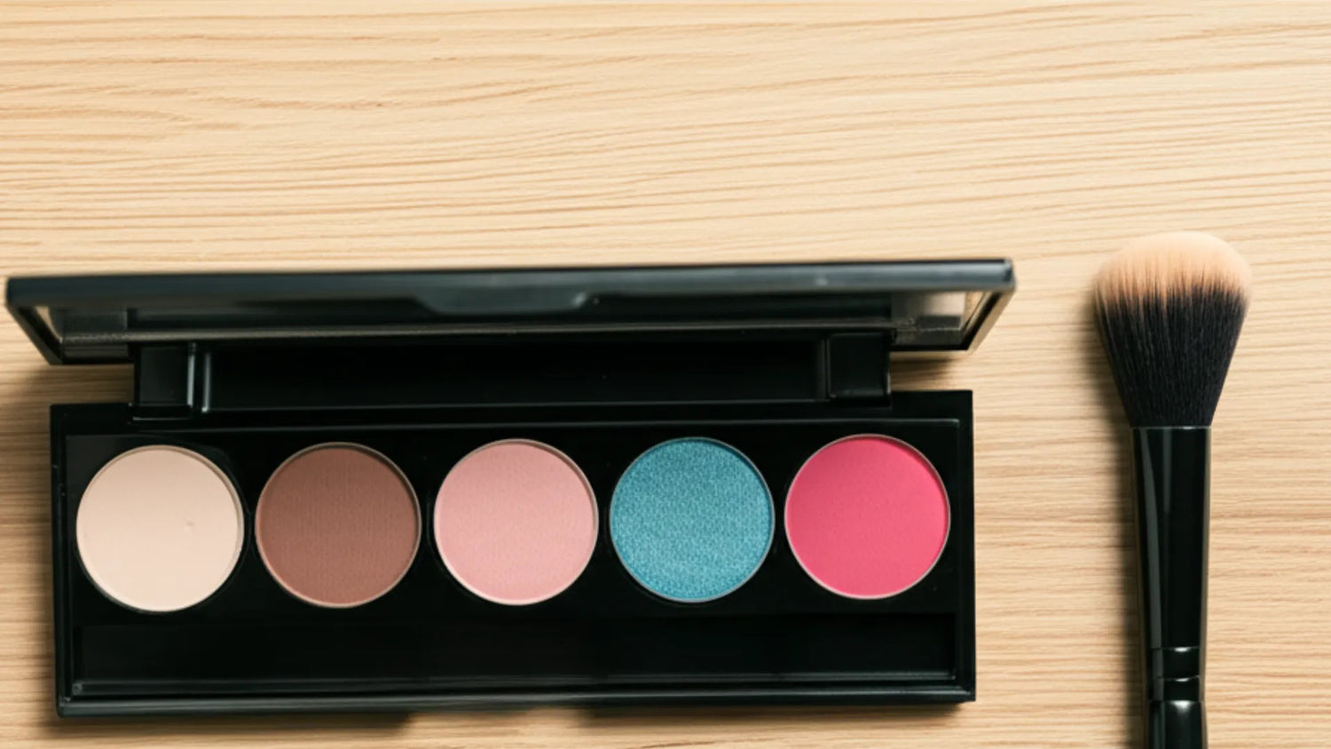 Pre-filled palette with makeup brush