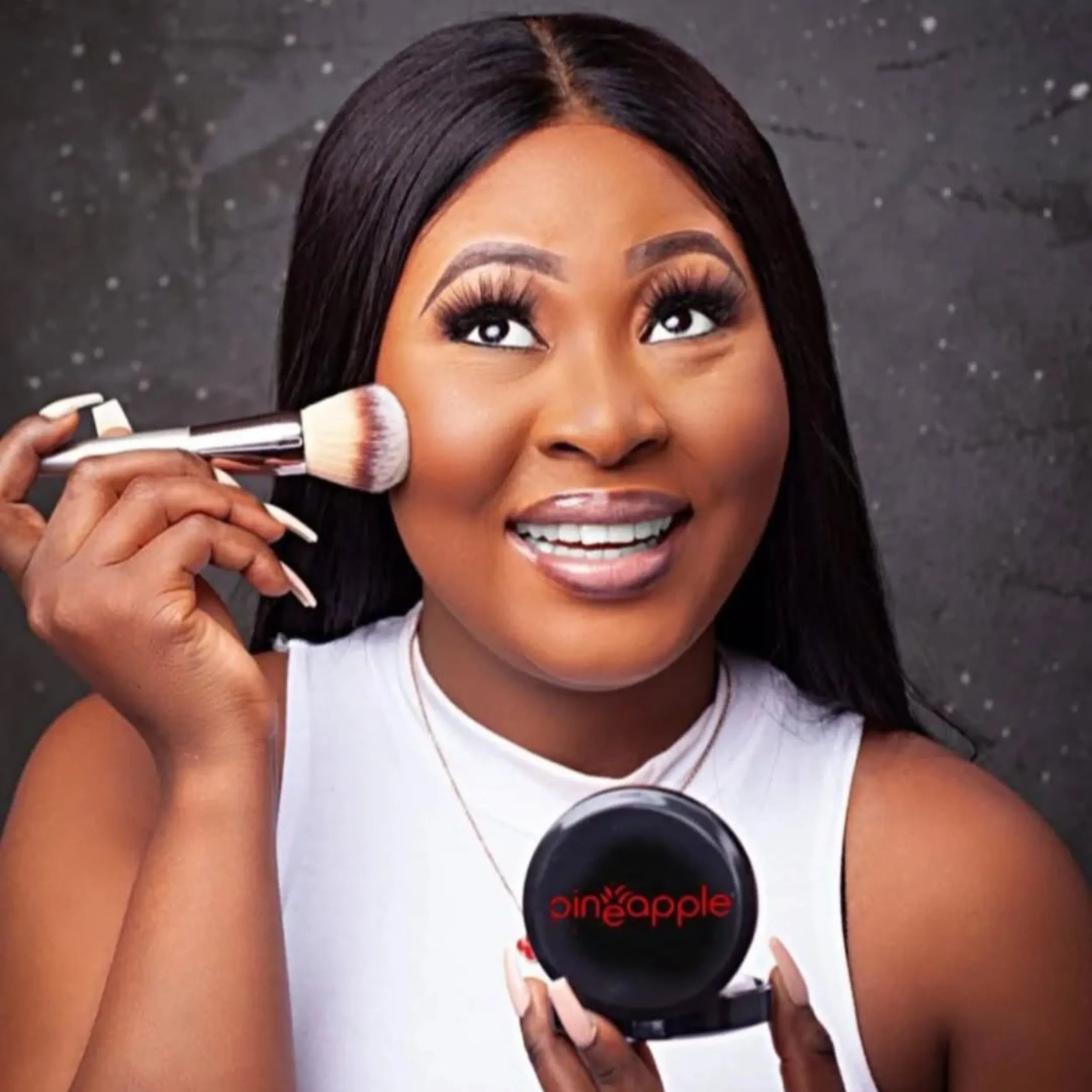 Woman applying foundation for social media photo